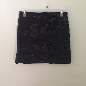 gold and black mini skirt