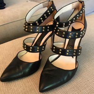 Boutique9 black leather heels w/gold stud wraps.