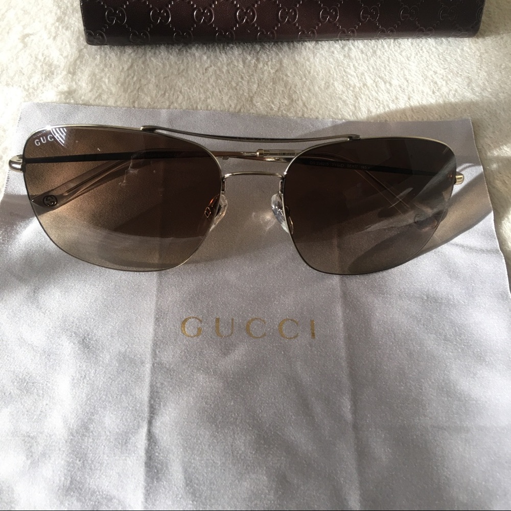Gucci Sun glasses golden brown tint