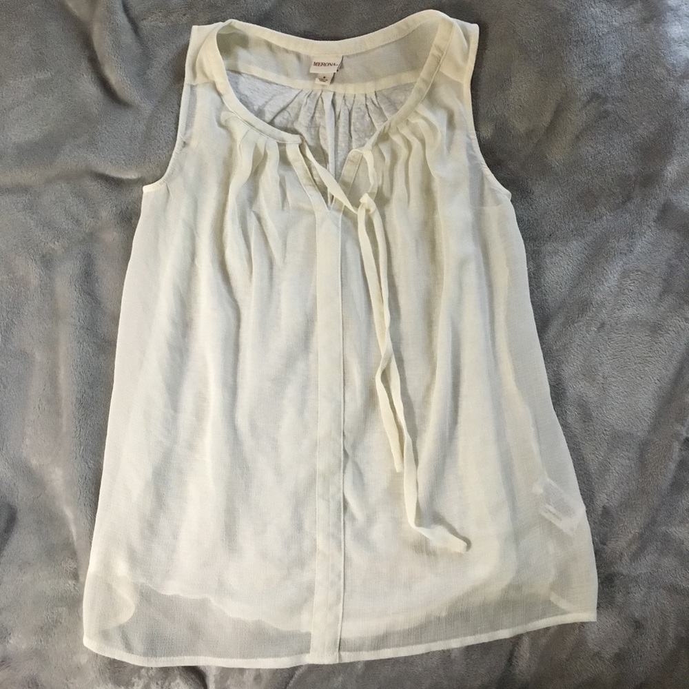 Cream sleeveless blouse