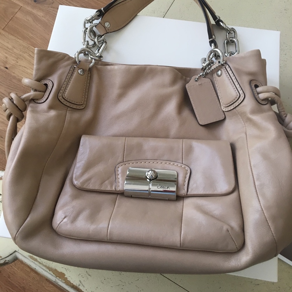 Tan Coach bag with chain accent straps