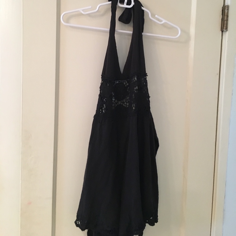 Black halter romper with crochet design in middle