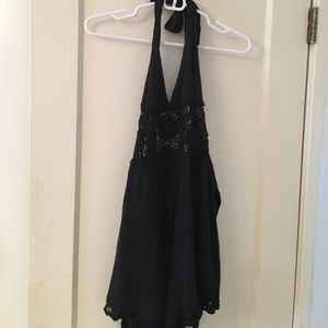 Black halter romper with crochet design in middle