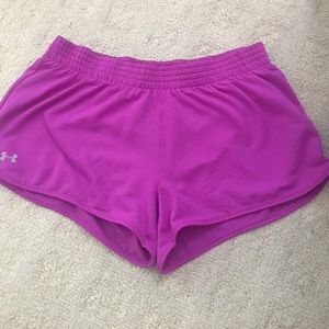Purple Under Armour mesh shorts.