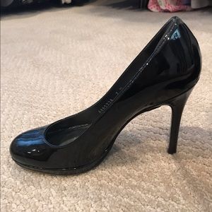 Stuart Weitzman black patent pumps