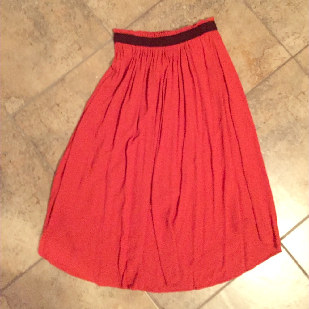 Pleated orange midi skirt