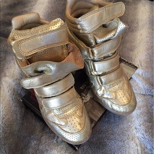 Gold Isabel Marant sneakers.