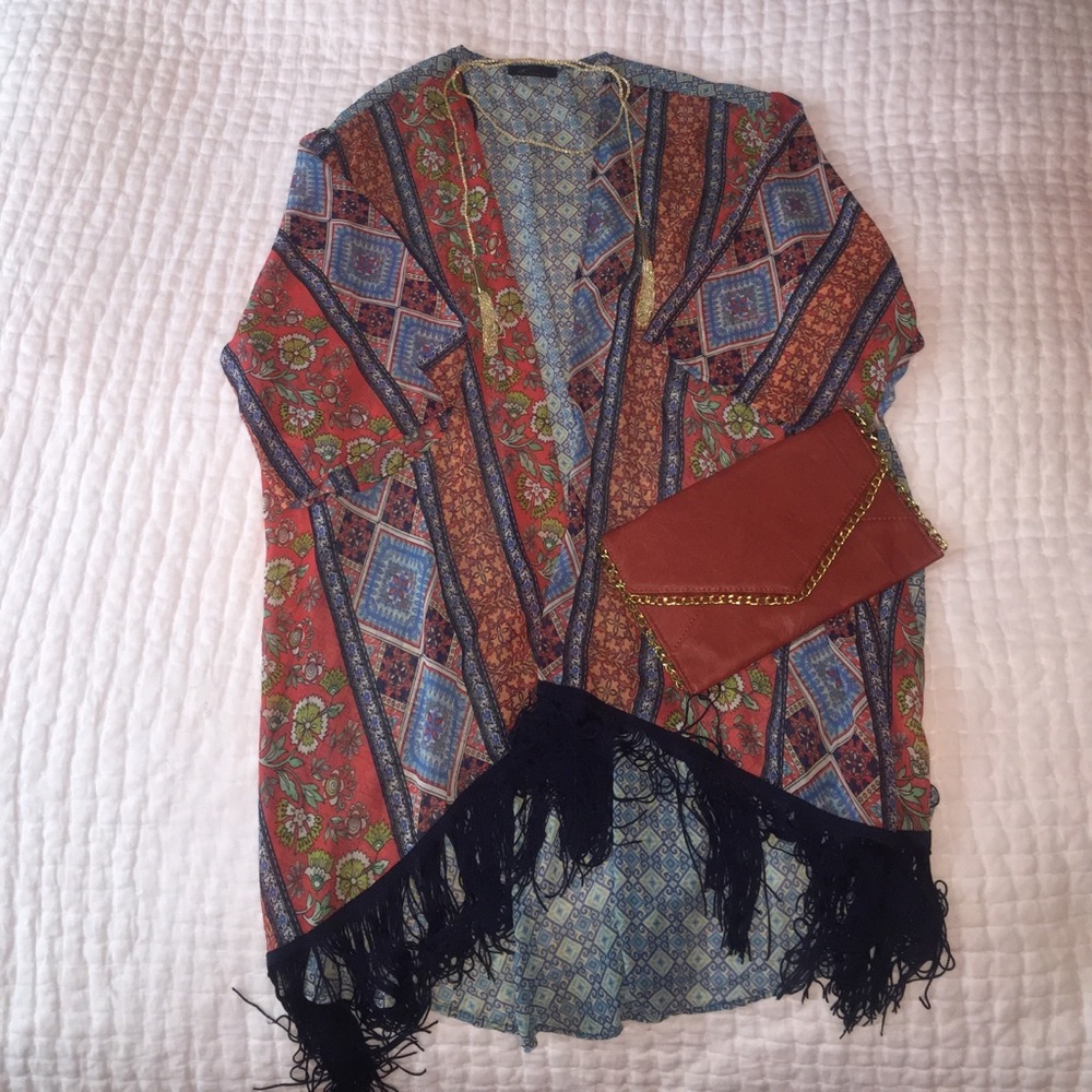 Multi patterned kimono with navy tassel fringe.