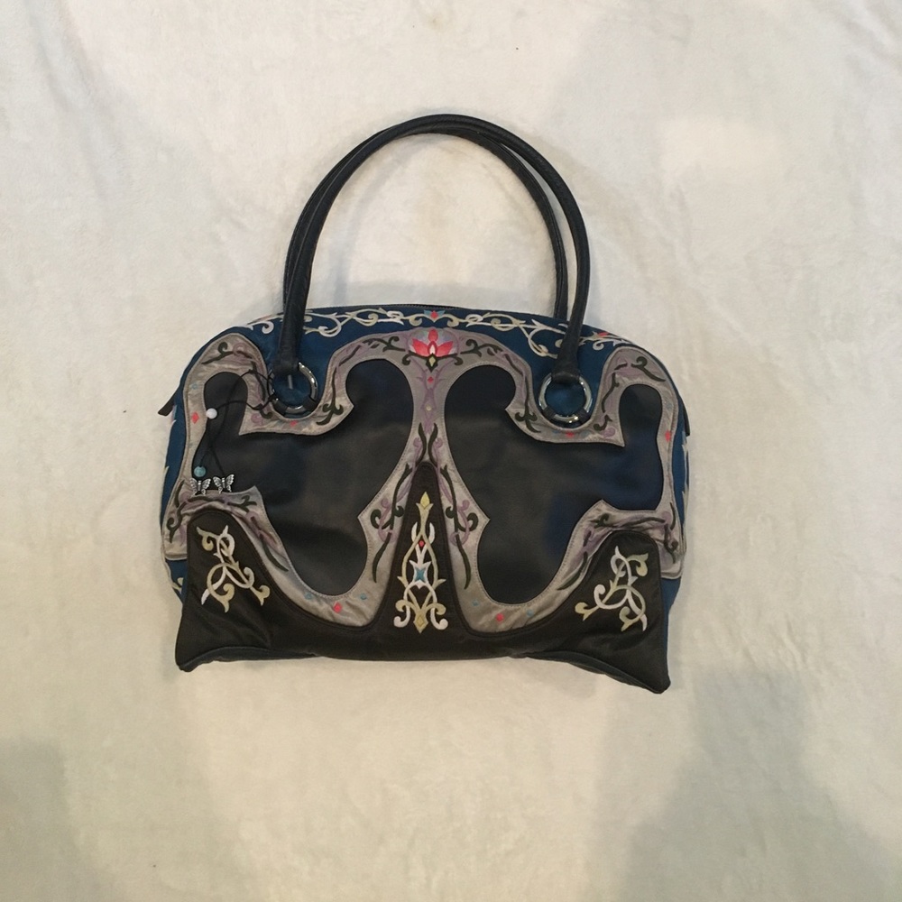 Hand stitched papillon handbag