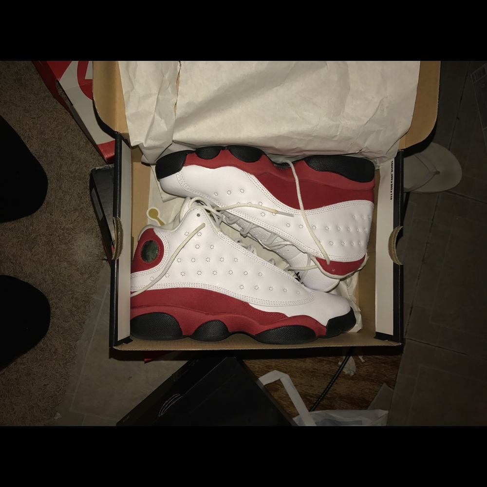 Red and white Jordan 13s