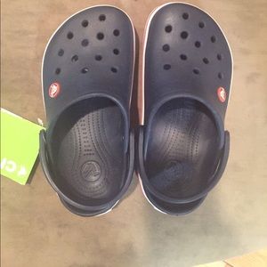 Brand new with tags. Navy blue Crocs size junior 2