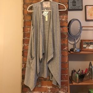 Grey asymmetrical vest with pockets