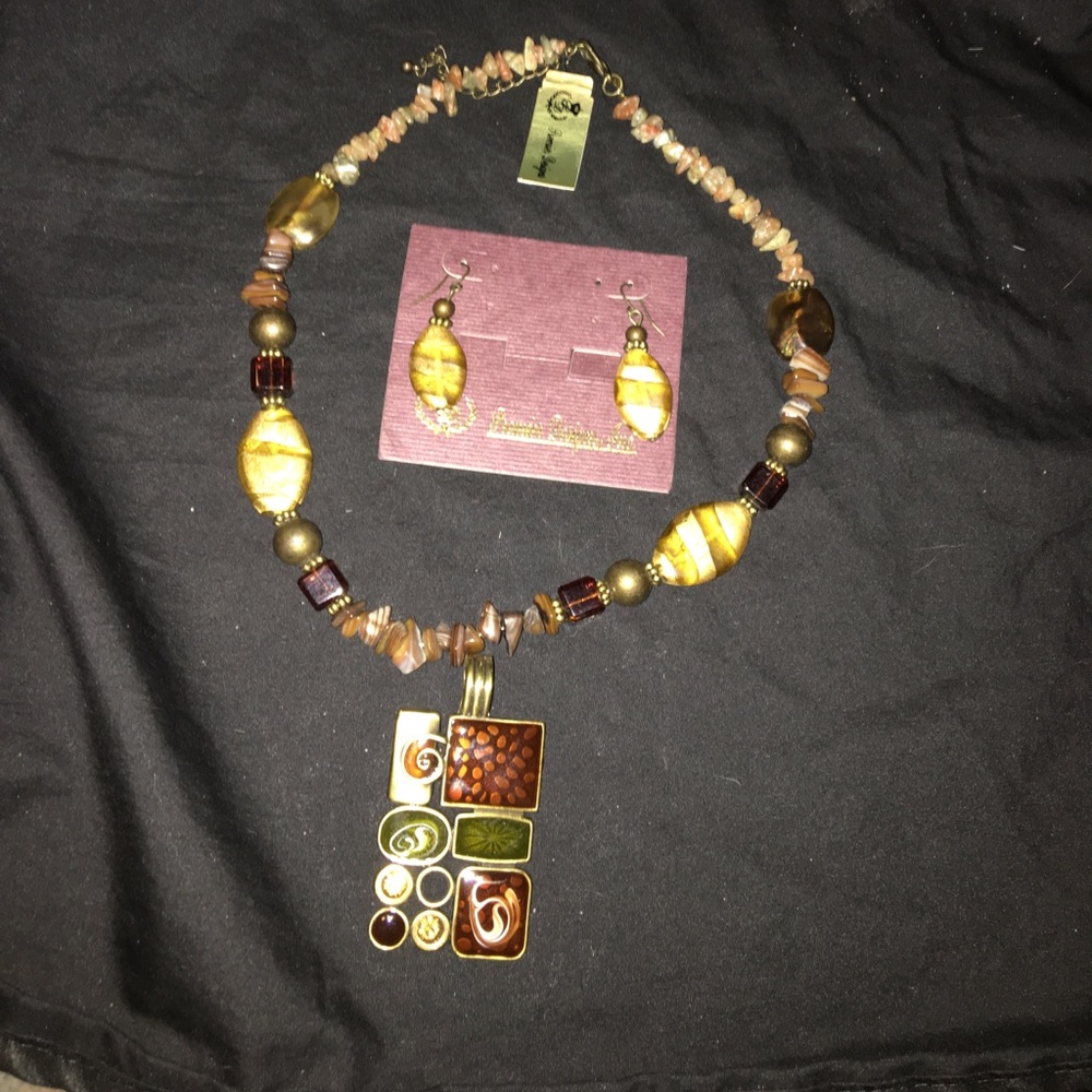 Necklace, necklace enhancer and earrings