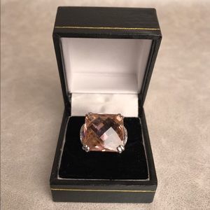 Silver plated ring with pink multifaceted stone