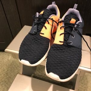 Rare Orange Volt and black Flyknit Nike Roche's