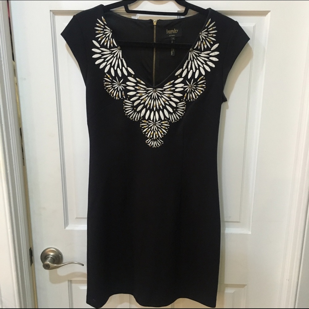 Classic black dress with detailed neckline