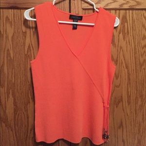 Orange v neck sweater with fringe detail
