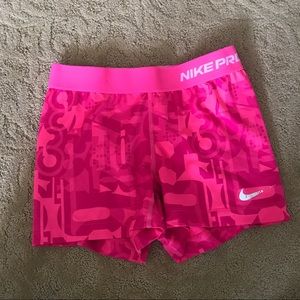 Pink Nike Pro women's compression shorts