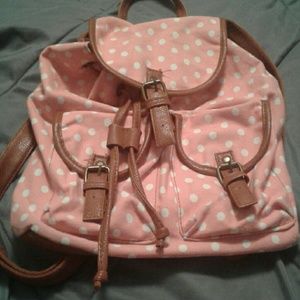 Pink and white polka dot backpack
