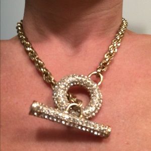Gold rope necklace with crystal clasp