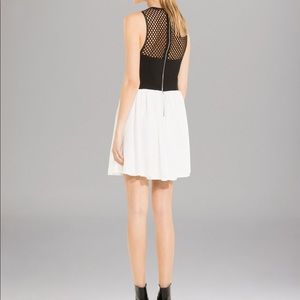 Sandro white mini dress with black sheer back