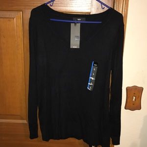 Long sleeved black v-neck sweater