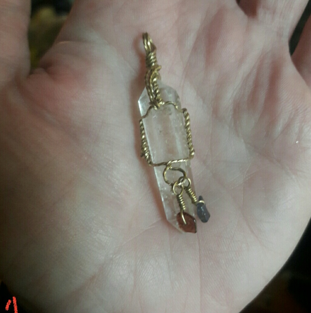 Raw quartz crystal pendant