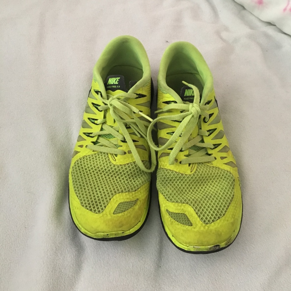 Neon yellow and black Nike frees