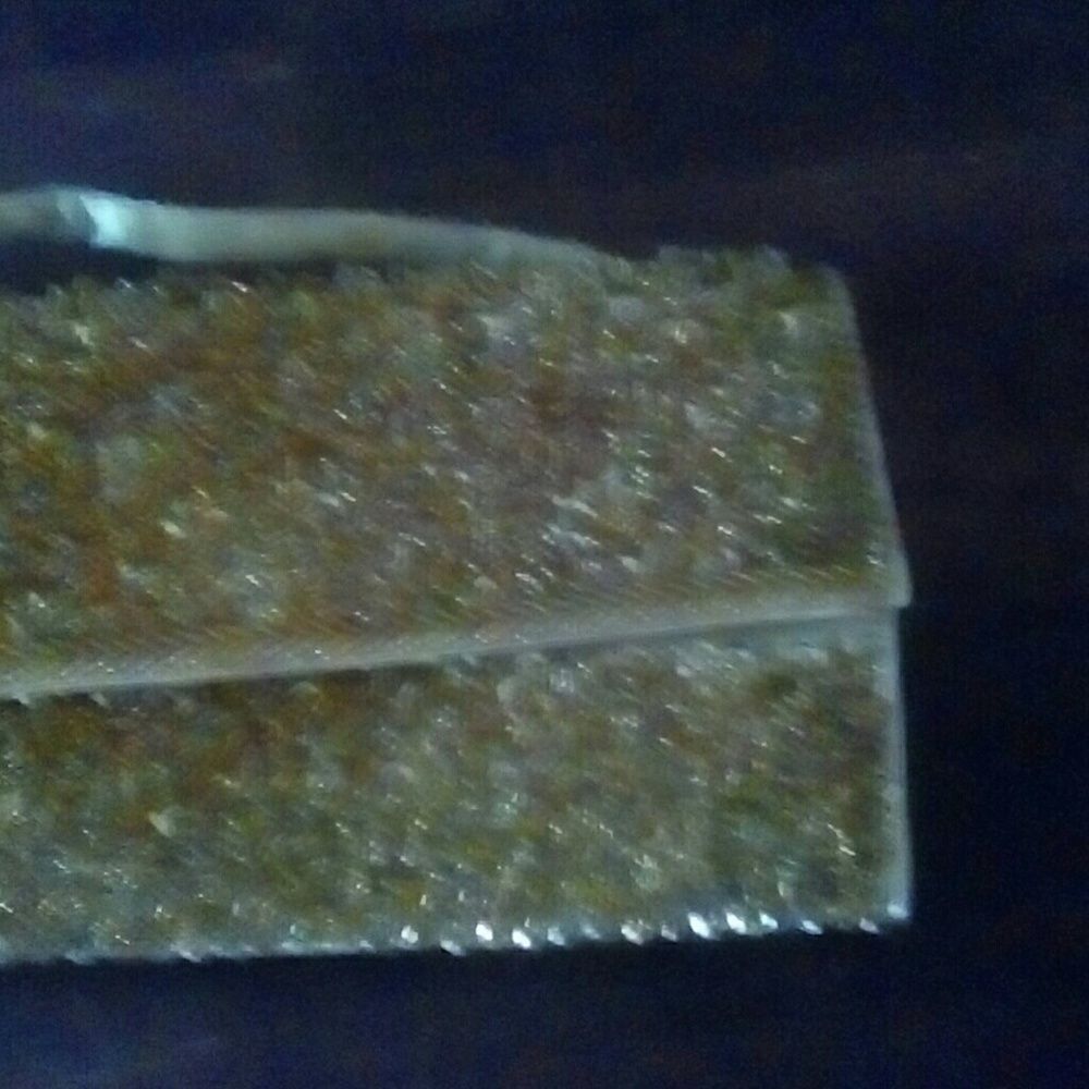 Gold and sequined envelope style pursue