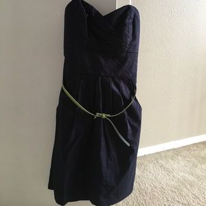 Strapless navy dress with pockets & a green belt
