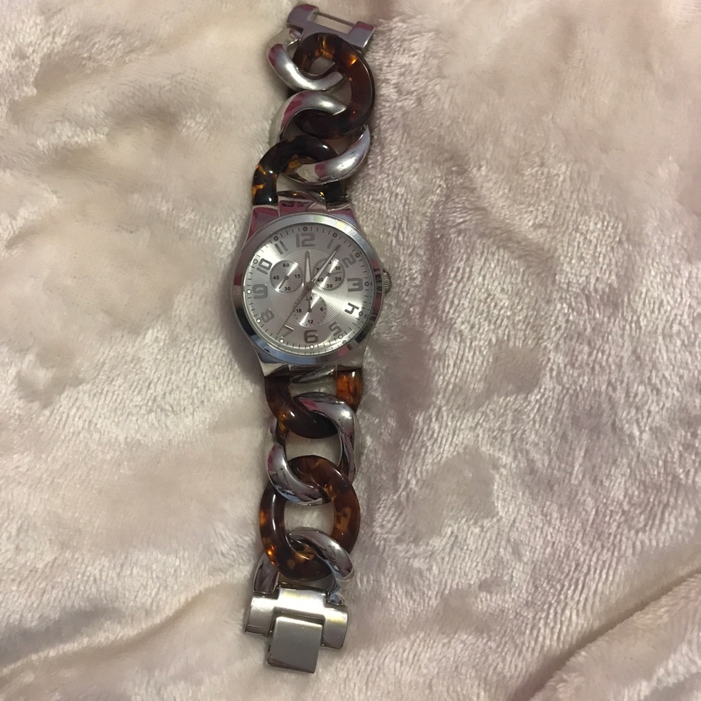 Tortoise and silver watch