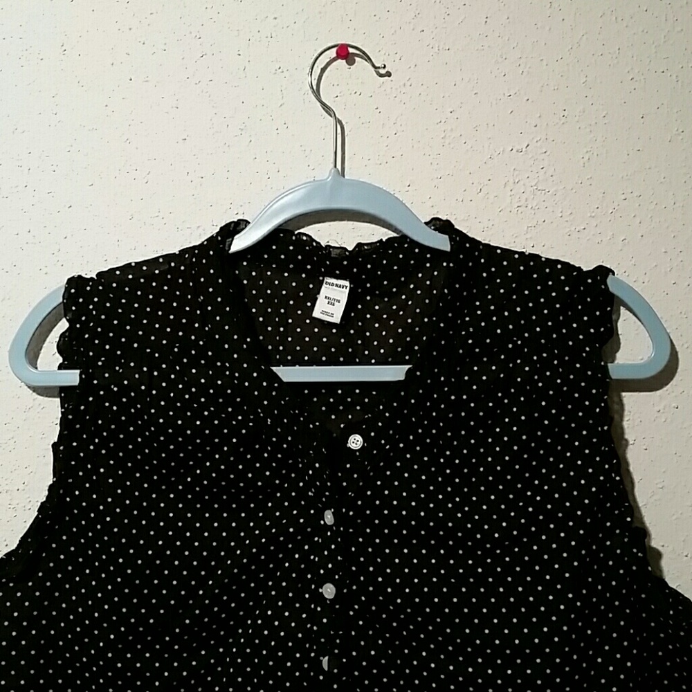Polka-dot throw over sleeveless blouse