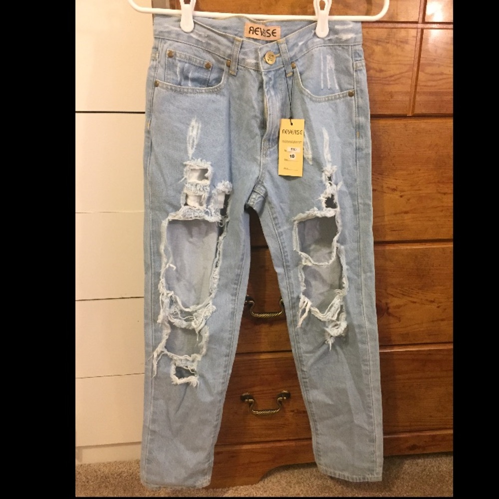 Distressed light wash denim jeans