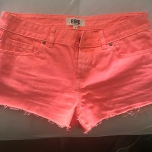 Bright orange short shorts