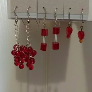 Set of 3 red pairs of earrings.