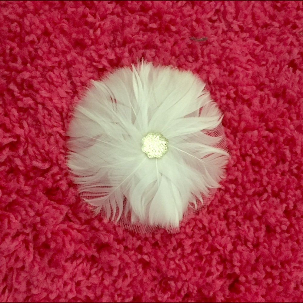 White feather brooch