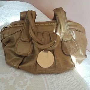 Beautiful gold Gustto leather bag