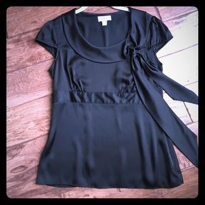 Satin black blouse. Stunning bow detail. Size zip.