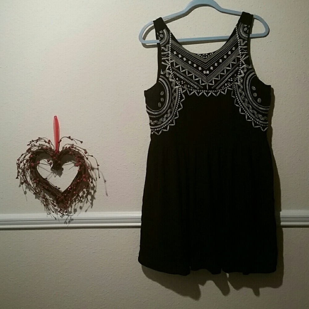 Black party dress with embroidered dress top.