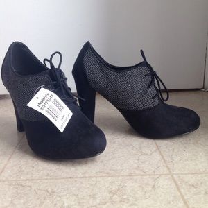 XOXO Jasmine lace up high heeled oxfords.