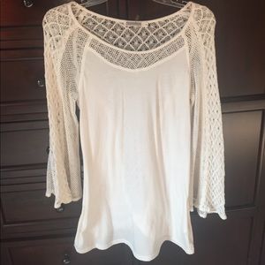 Long sleeve white top with a lot of detail