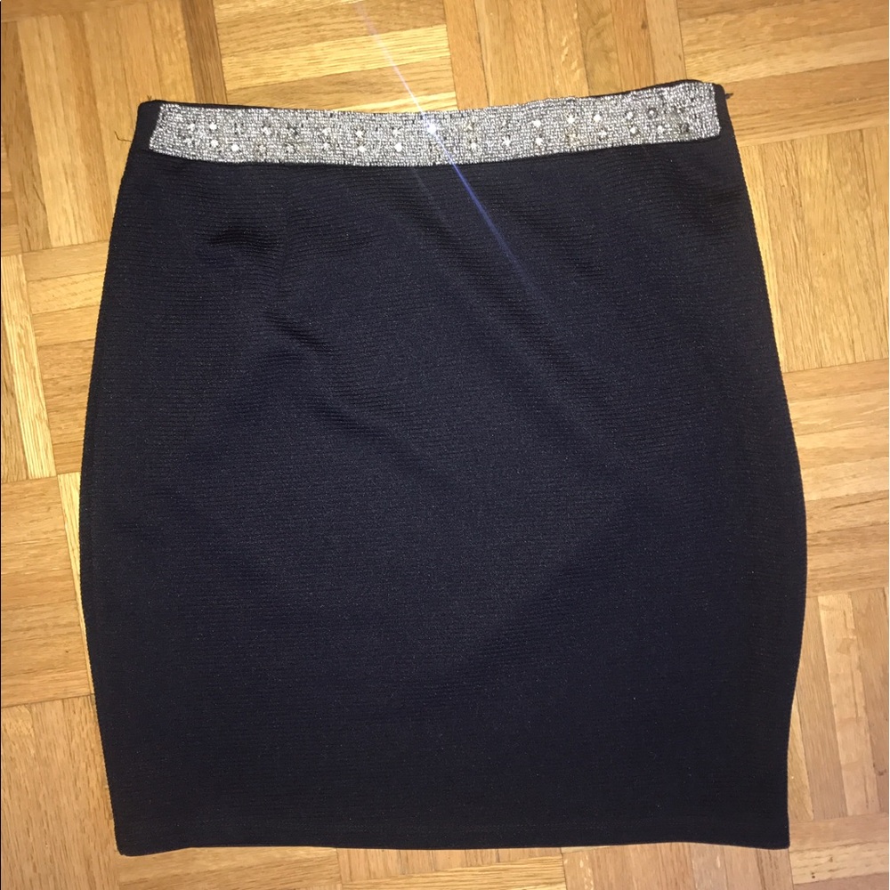 Navy blue pencil skirt with embelished waist band.