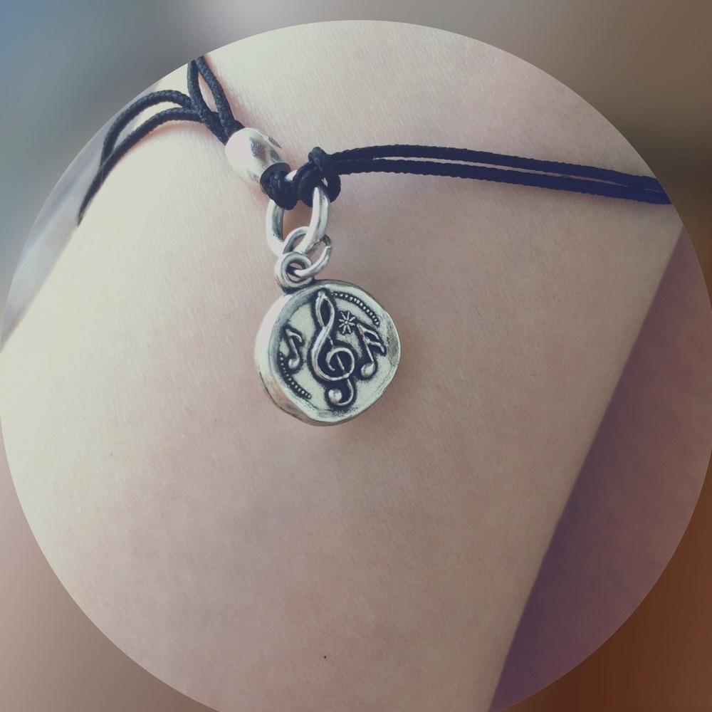 Black bracelet with musical note detail