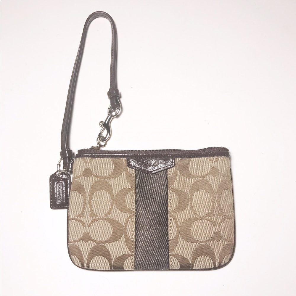 Signature brown Coach wristlet. Never used.