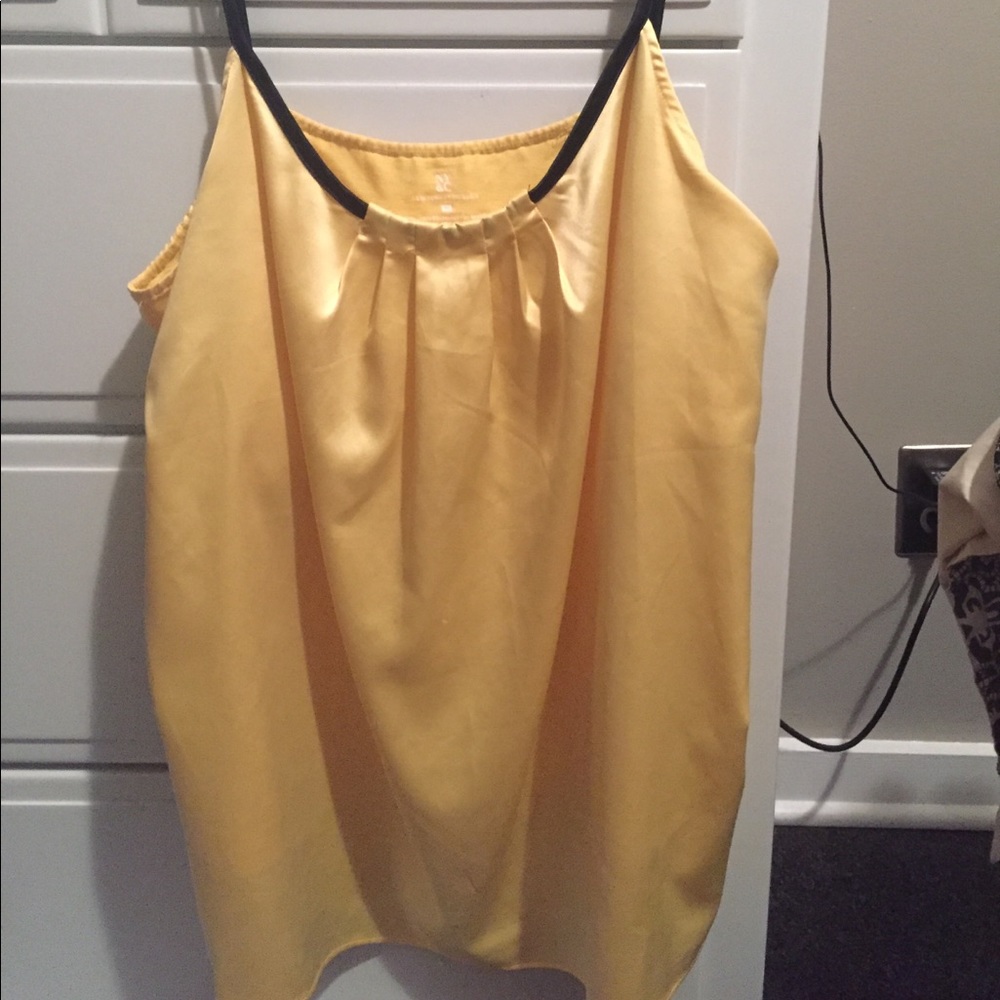 Beautiful yellow tank top with adjustable straps.