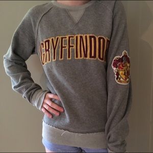 Light grey Gryffindor crewneck sweatshirt.