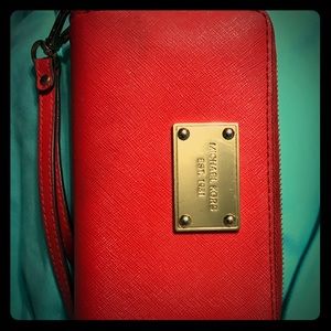 Orange Michael Kors wristlet