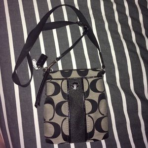 Black/gray Coach cross body bag.