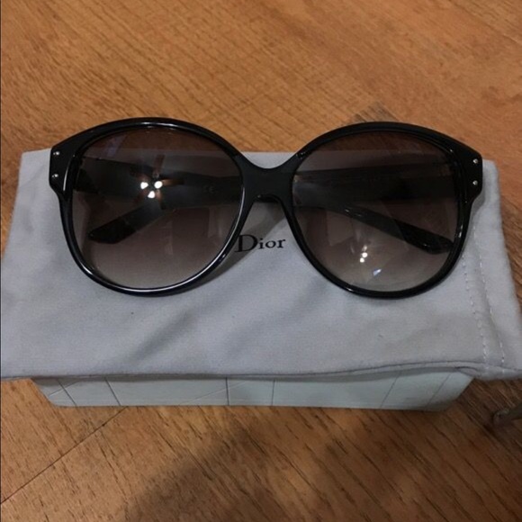 Black framed Dior sunglasses in case