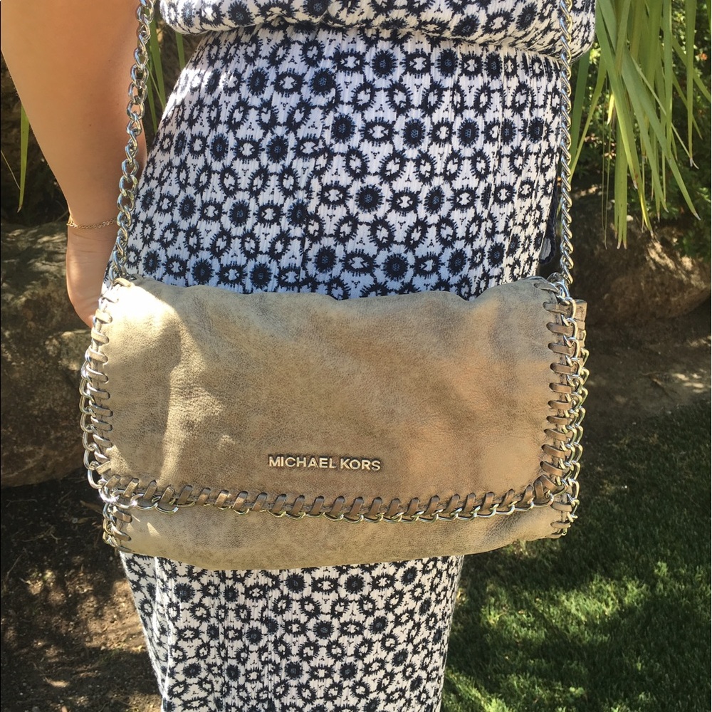 Micheal Kors silver cutch with long chain!